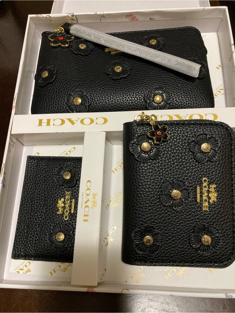 Coach Black Pebbled Leather Floral Zip Phone Wallet with Charm